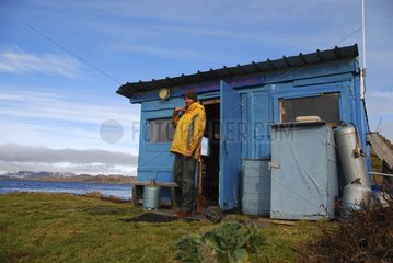 Biologist at the hut that serves as a shelter of land