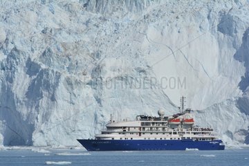 Denmark. Greenland. West coast. The Sea Explorer I  cruise boat  in front of the glaciar Eqip Sermia in the Quervain bay.