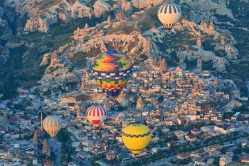 Turkey. Ballooning in Cappadocia. Every morning or so  around one hundred balloons are taking off near Goreme for one hour flight upon the best places of Cappadocia. Here the village of Goreme.