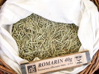 Dry plant (Rosmarinus officinalis) for infusion with its name in a basket