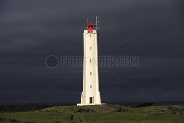 Lighthouse in a stormy sky Arnarstapi Iceland