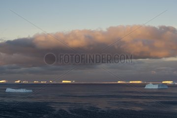 Sunset over icebergs Adélie Land Antarctica