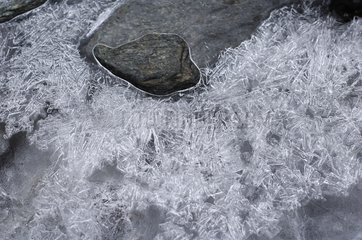 Ice cracked on stone Valais Switzerland
