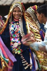Taru people dancing in traditional costume Terai India