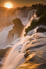 View of the rising sun over the falls of Iguazu Argentina