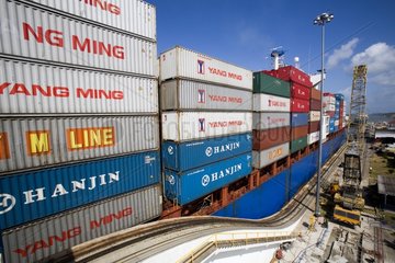 Container ship running the Gatun locks Panama Canal