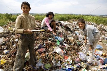 Gipsies Children sorting out scraps at the dustbin