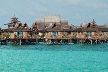 Bungalows on pile of a hotel on the island of Mabul Malaysia