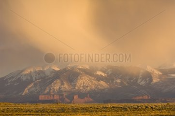 Snow storm at sunset over Arches National Park USA