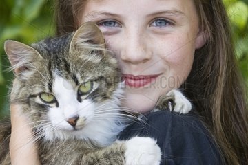 Portrait of a girl with a cat