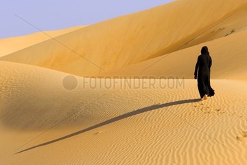 Bedouin in the dunes Abu Dhabi United Arab Emirates