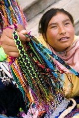 Young Indian girl saleswoman of bracelets Mexico