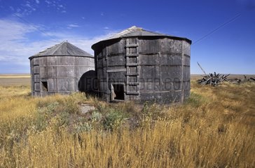 Old wooden cylindrical silos Saskatchewan Canada