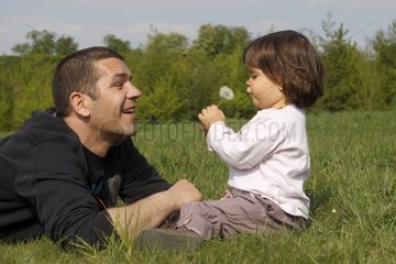 Child from 20 months discovering the nature with her father