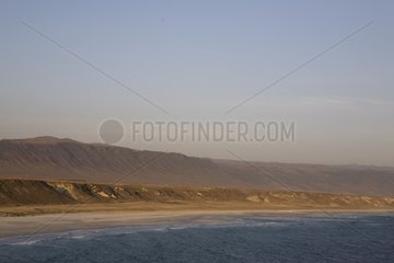 Blue sky on the coastal landscape of the Sea of Oman