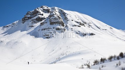 Hiker in the snow in the Mercantour France