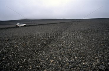 Car on a desert high plateau Iceland