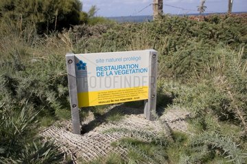 Blue sign heathland restoration near Cancale Brittany France