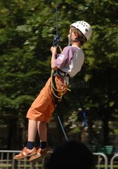 Young boy goes down in tyrolean in tree climbing