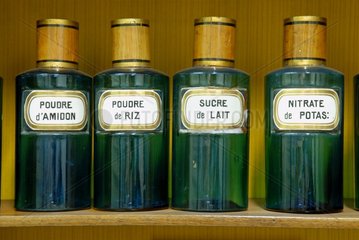 Old bottles in a pharmacy window France