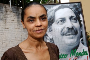 Senator Marina Silva with a photo of Chico Mendes Brazil