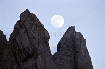 The full moon above a rock peak Spain