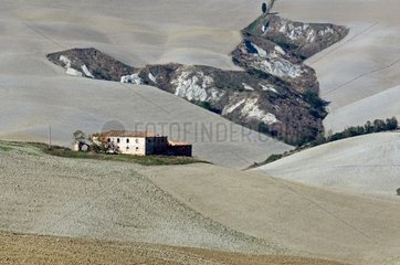 Farm surrounded by fields in the Tuscan Crests region