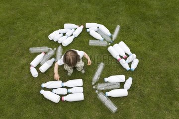 Child and recycling standard logo made with plastic bottles