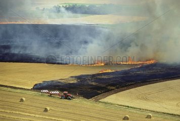 Air shot of a straw fire in harvested field