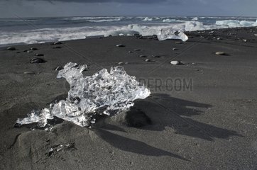 Ice blocks on black sand Joekulsárlón Iceland