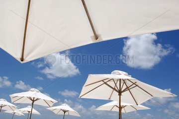 Umbrellas on the beach of the Kanuhur island Maldives