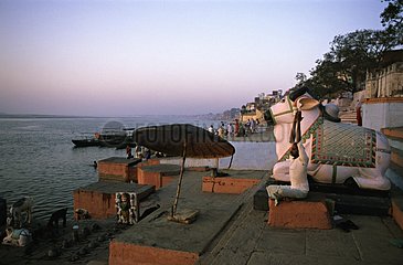 Nandi statue at the edge of the Ganges Benares India