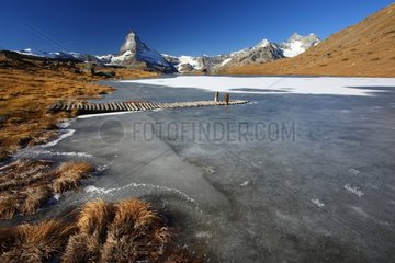 Matterhorn and frozen Lake Stellisee Switzerland