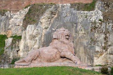 Sculpture The Lion de Belfort at the foot of a cliff France