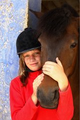Portrait of a young girl with her Horse