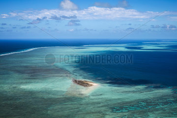 Aerial view of the reef  in the foreground  the island of the aviators and behind the famous pass in S of the island of Mayotte  Mayotte  Indian Ocean