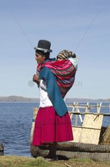Aymara woman and her baby near Lake Titicaca Bolivia