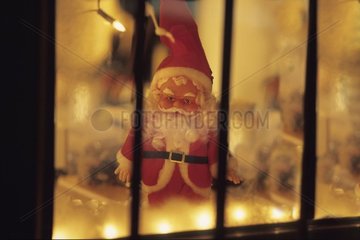 Christmas decoration and Father Christmas behind a window