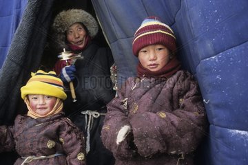 Tibetan children at the entry of a store Xiewu Kham area