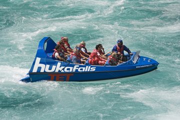 Tourists in Huka Falls jet boat on Waikato River
