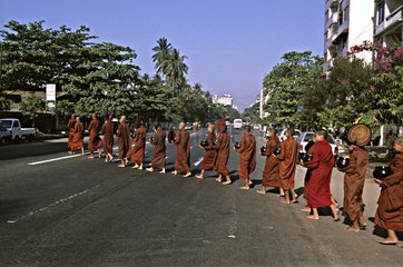 Procession of young bhikkhu in a street Burma