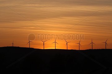 Windmill park of Névian at sunset France