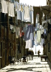 Hanging laundry in a narrow street at Venice Italy