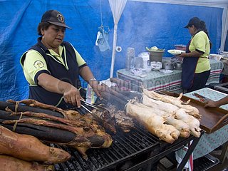 Preparing grilled Domestic Guinea Pigs Quito Ecuador