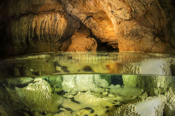 Underground lake in a cave with many concretions  Ain  France
