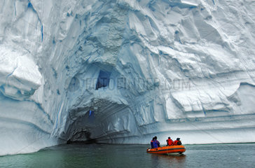 Ice tunnel. Drifting iceberg. Foyn Harbor  Antarctic Peninsula.