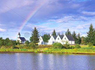 Rainbow on a chapel  Thingvellir National Park or Pingvellir  World Heritage Site by UNESCO  Iceland