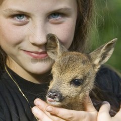 Portrait of a girl wearing a fawn