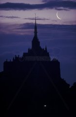 Moon raise on the Mont Saint-Michel in the morning Manche
