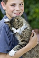 Portrait of a boy with a cat